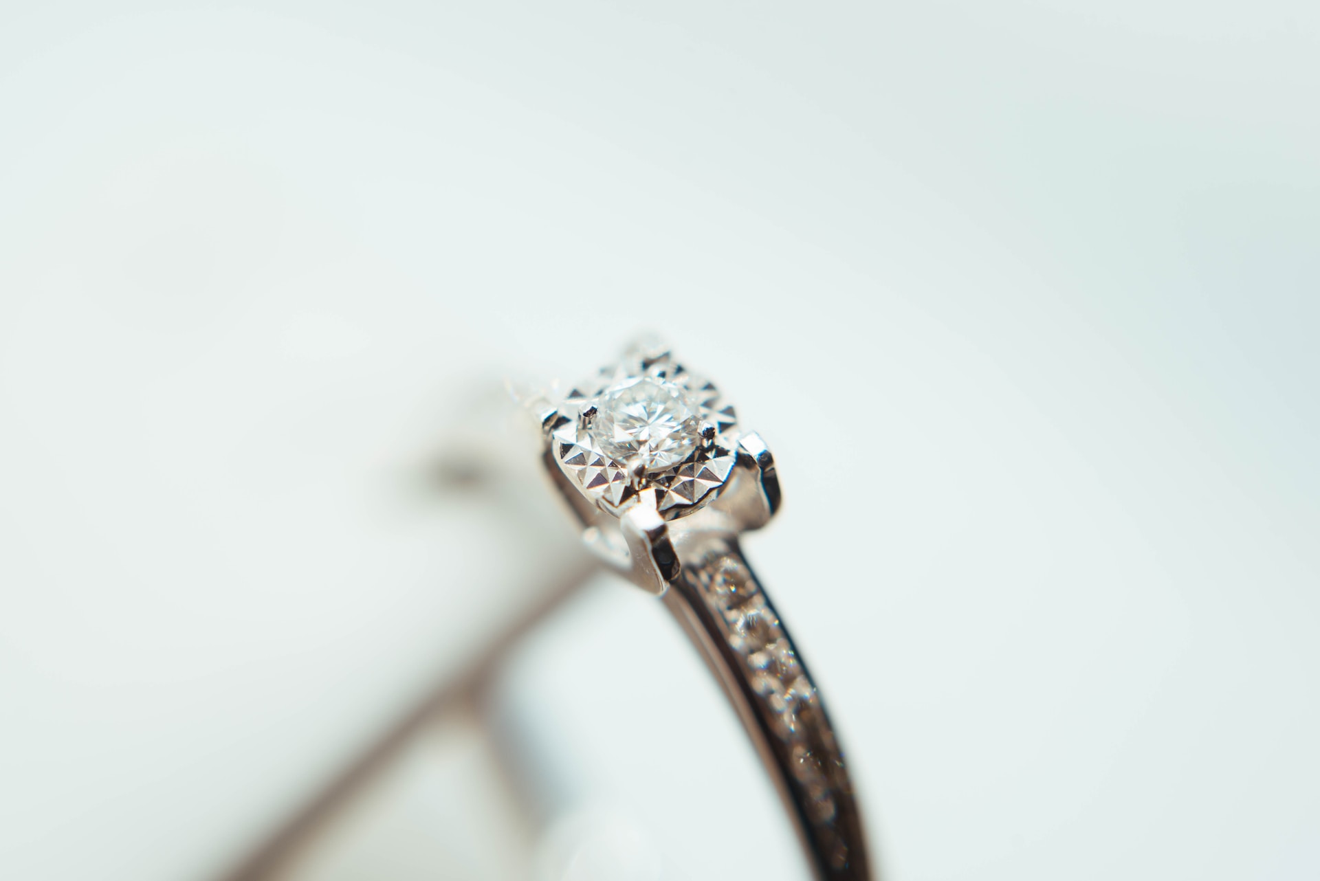 a white gold engagement ring with side stones a white gold engagement ring with side stones